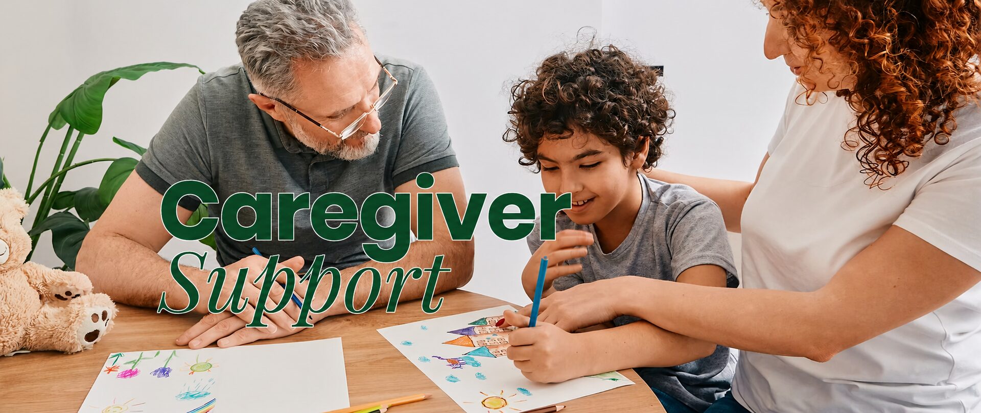 Caregiver support — family drawing together with their child